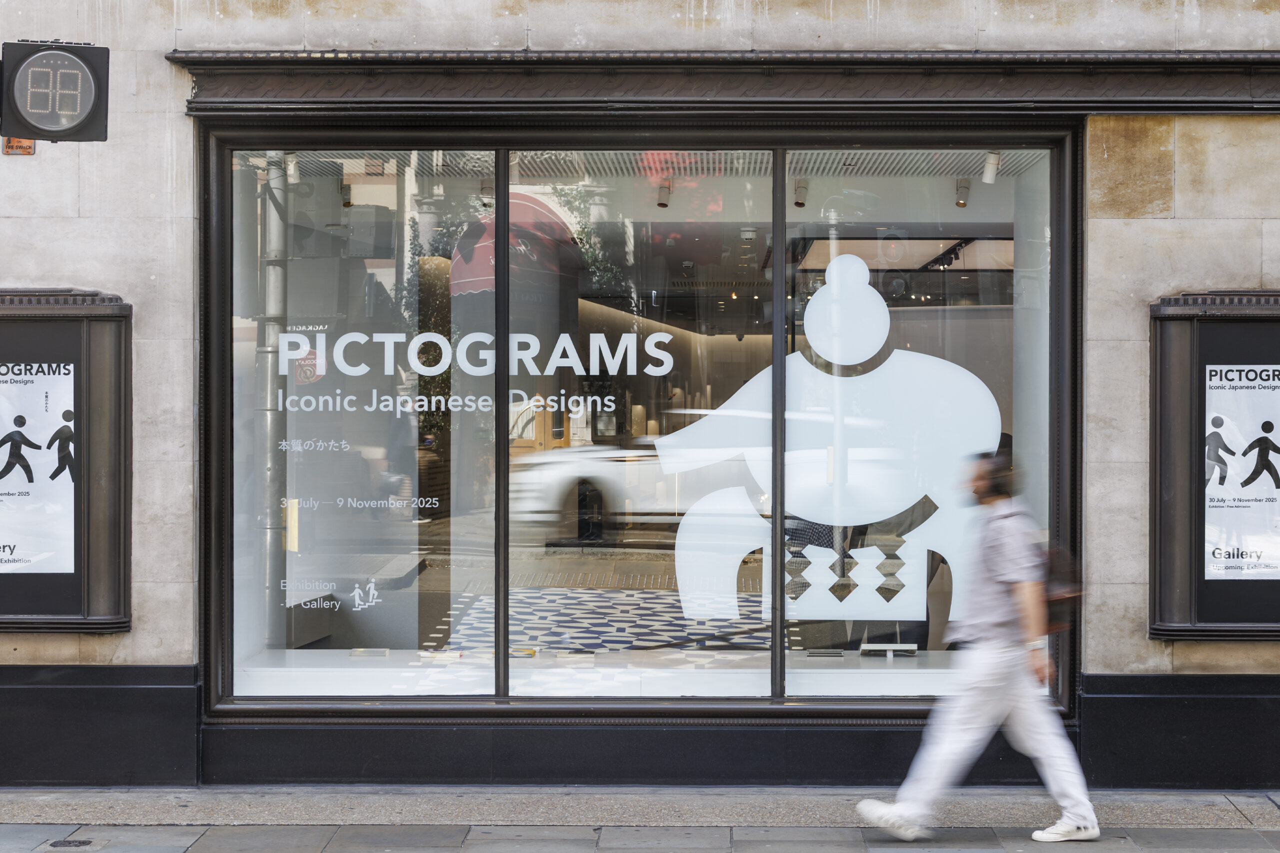 Front facade of the Pictograms exhibition, featuring minimalist design elements and entrance branding.