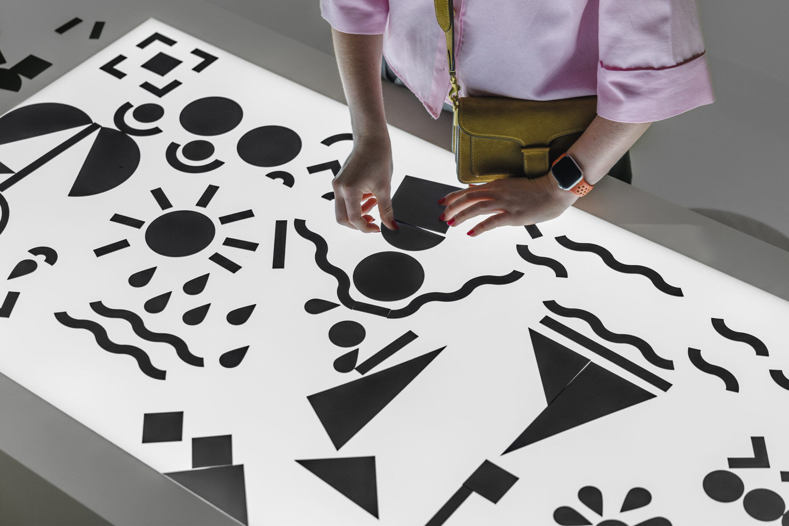 Interactive panel allowing visitors to touch and play with pictogram components.