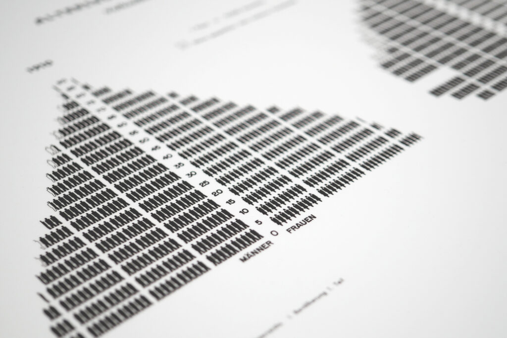 Timeline panel tracing the historical evolution of Japanese pictograms.